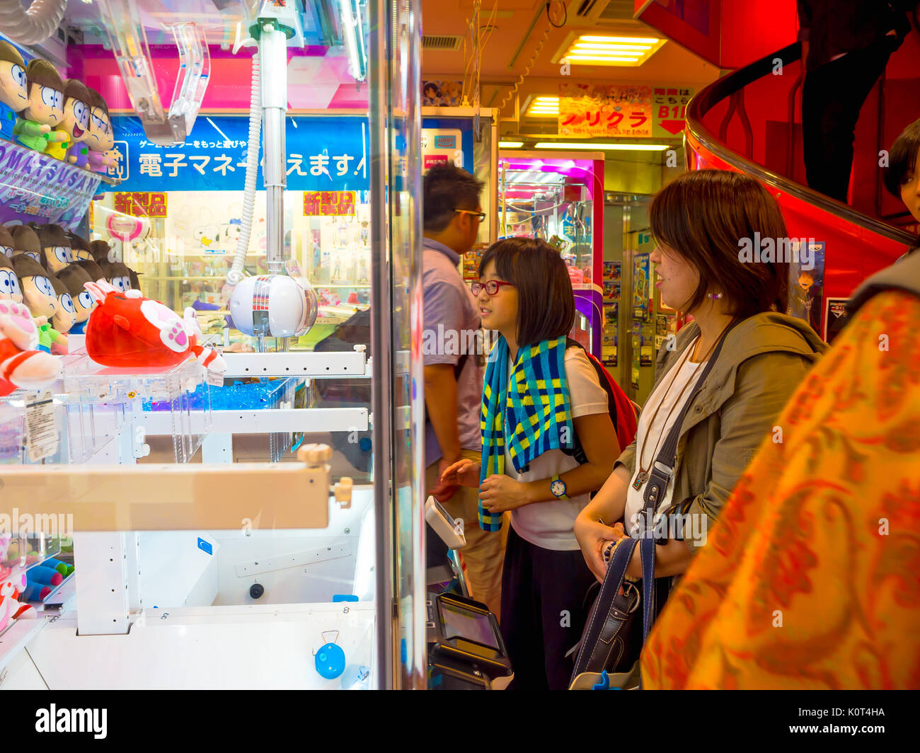TOKYO, JAPAN JUNE 28 - 2017: Unidentified people looking the assorted hello Kitty dolls in a toy coin machine in Tokyo Stock Photo