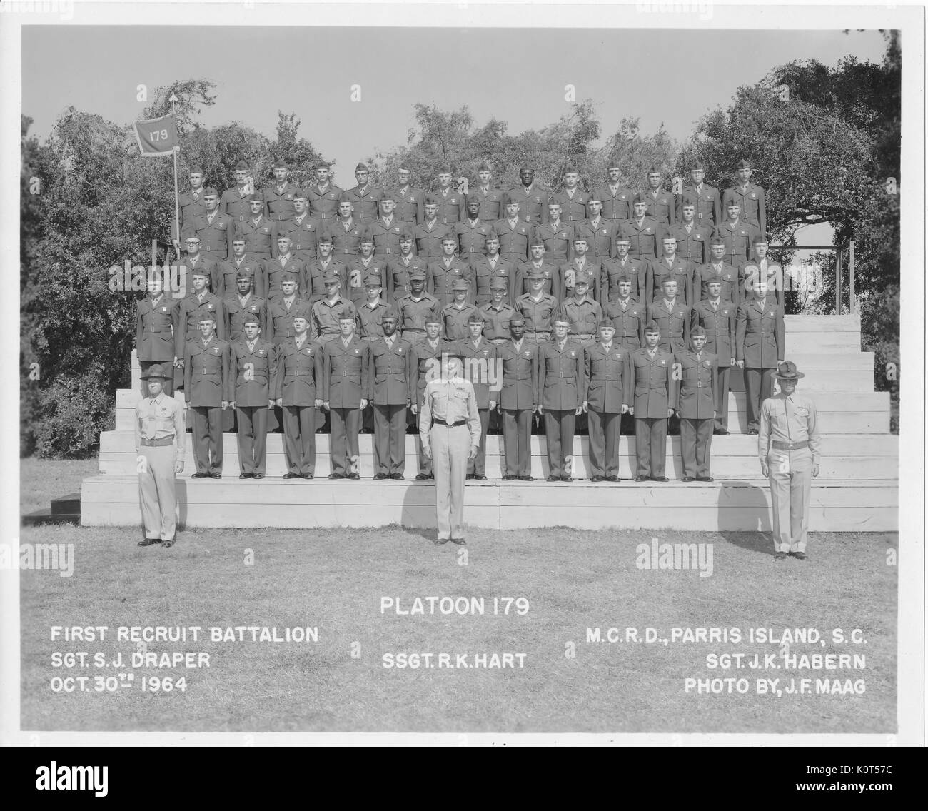 A photograph of Platoon 179 in training with the 1st Recruit Battalion, they are newly enlisted personnel with the United States Marine Corps, they are posing with two sergeants and a staff sergeant, Parris Island, South Carolina, October 30, 1964. Stock Photo