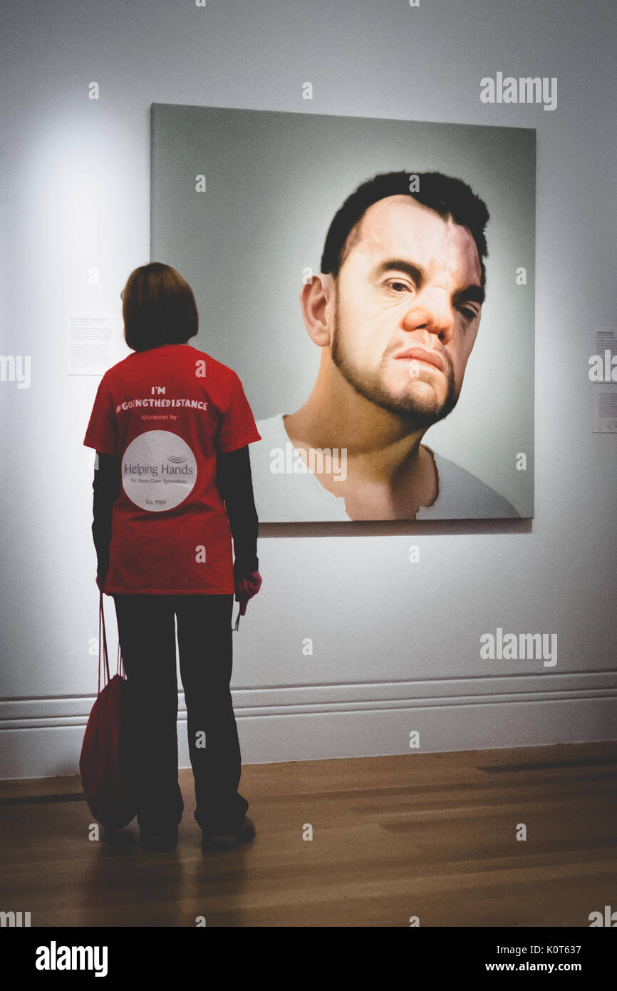 A visitor at the National Portrait Gallery in London (UK). July 2017. Portrait format. Stock Photo