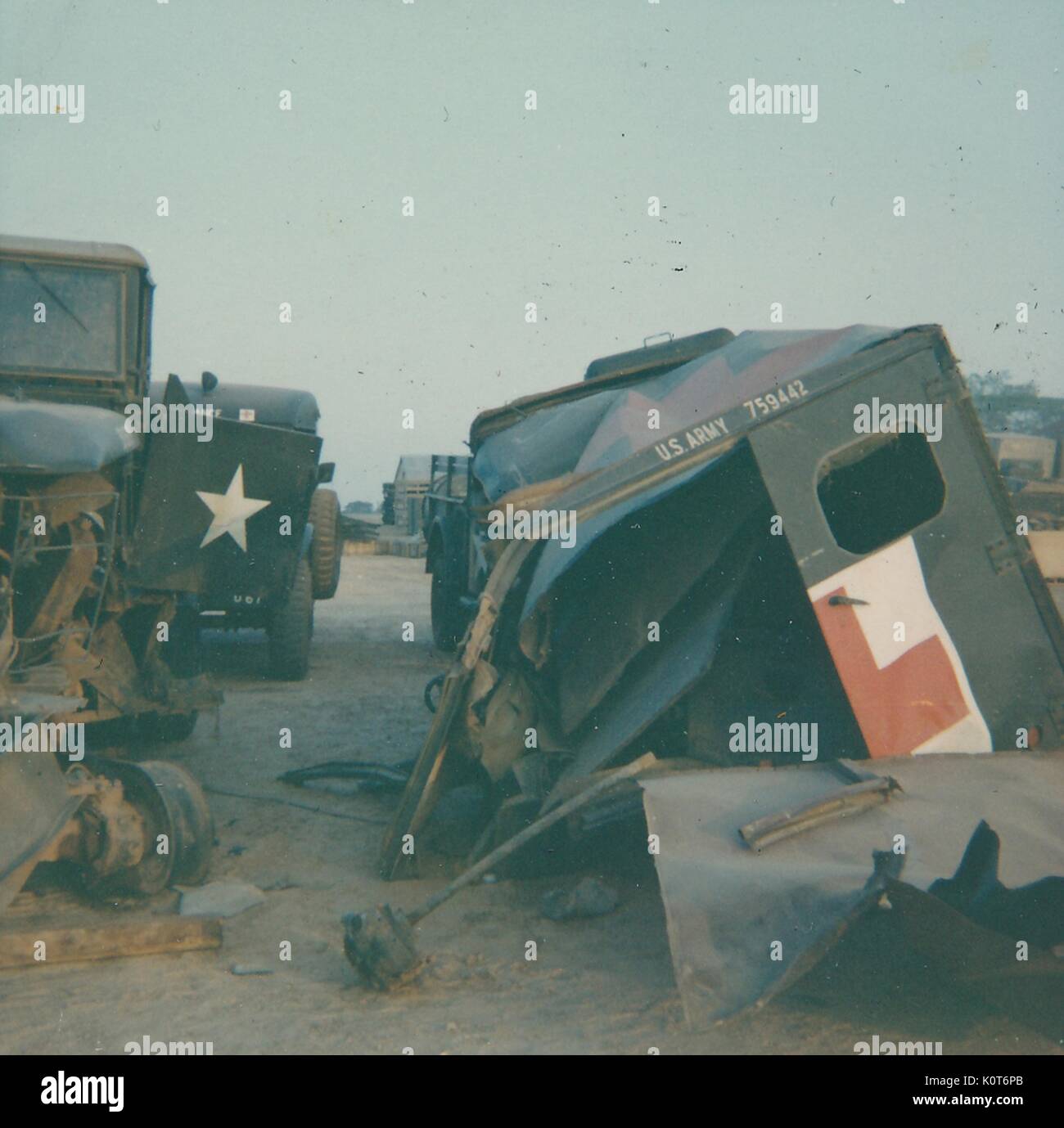 A photograph of damaged military vehicles, structural damage to can be ...
