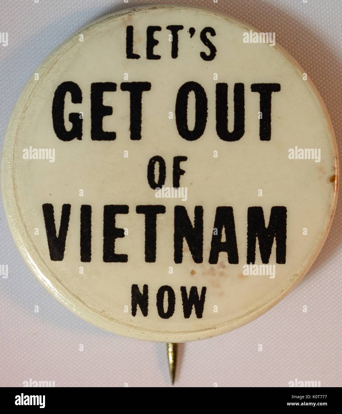 An anti-Vietnam War pin that reads 'Let's get out of Vietnam now', 1968. Stock Photo