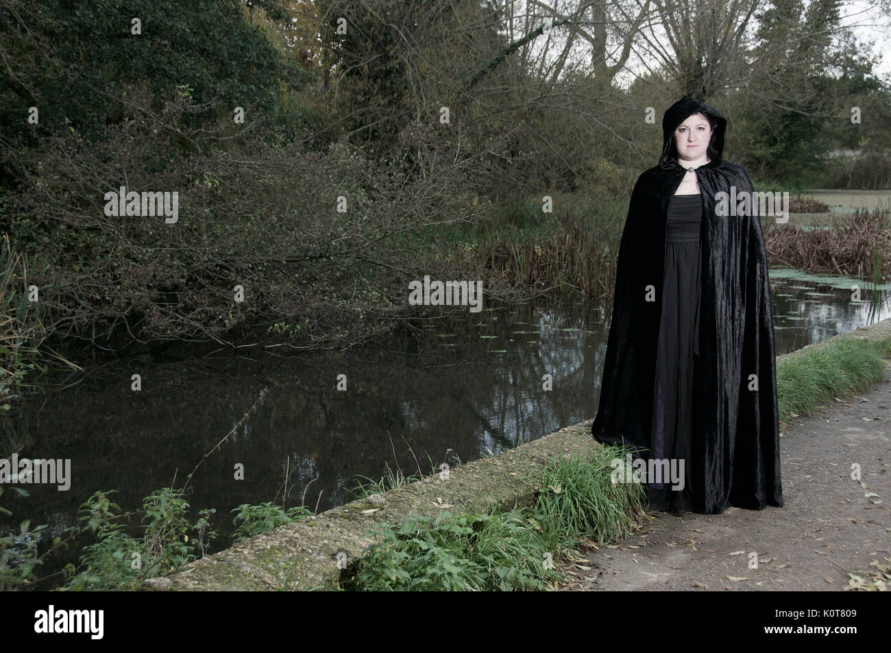 Black long cloak hi-res stock photography and images - Alamy
