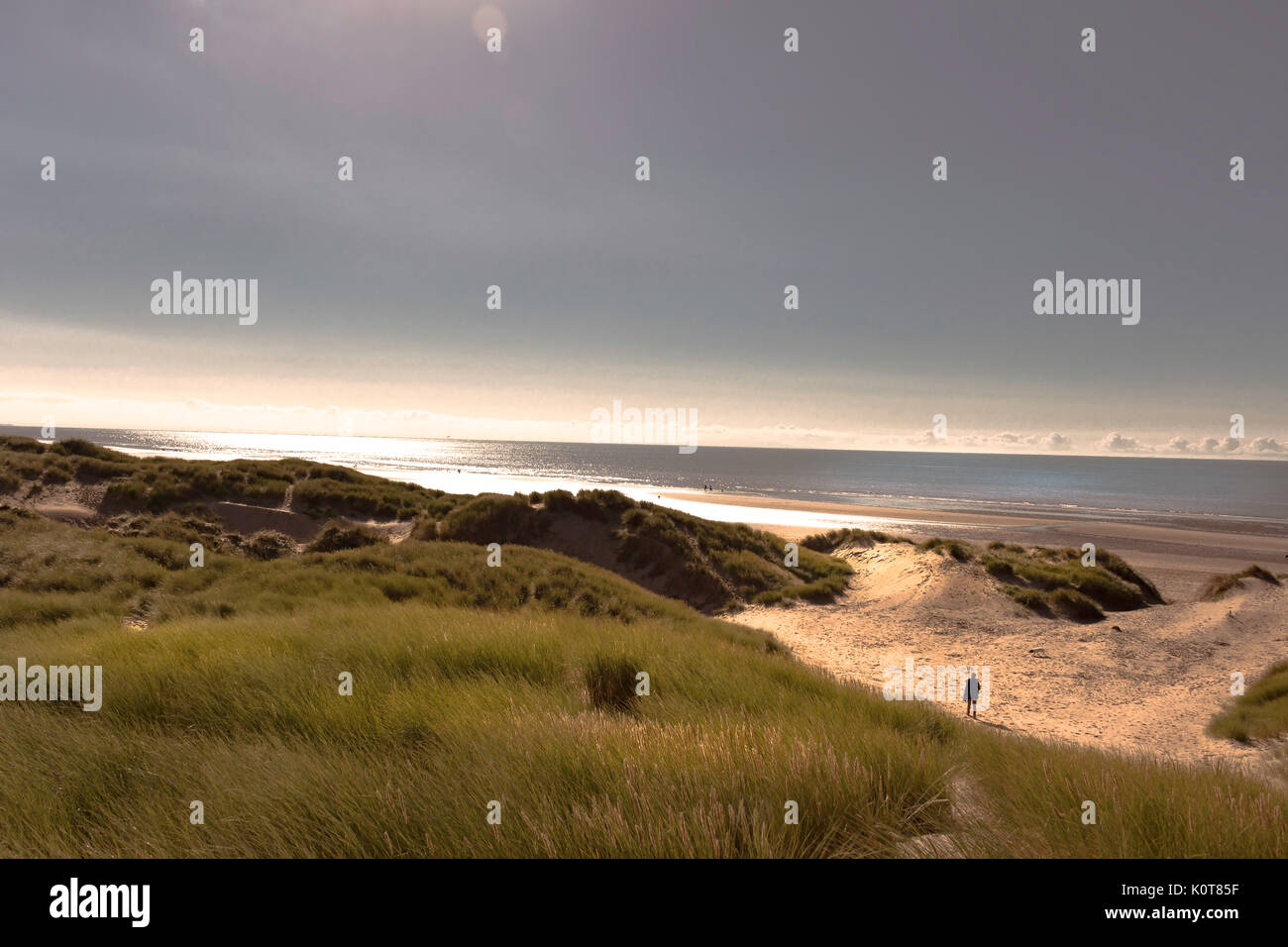 person alone on the beach Stock Photo