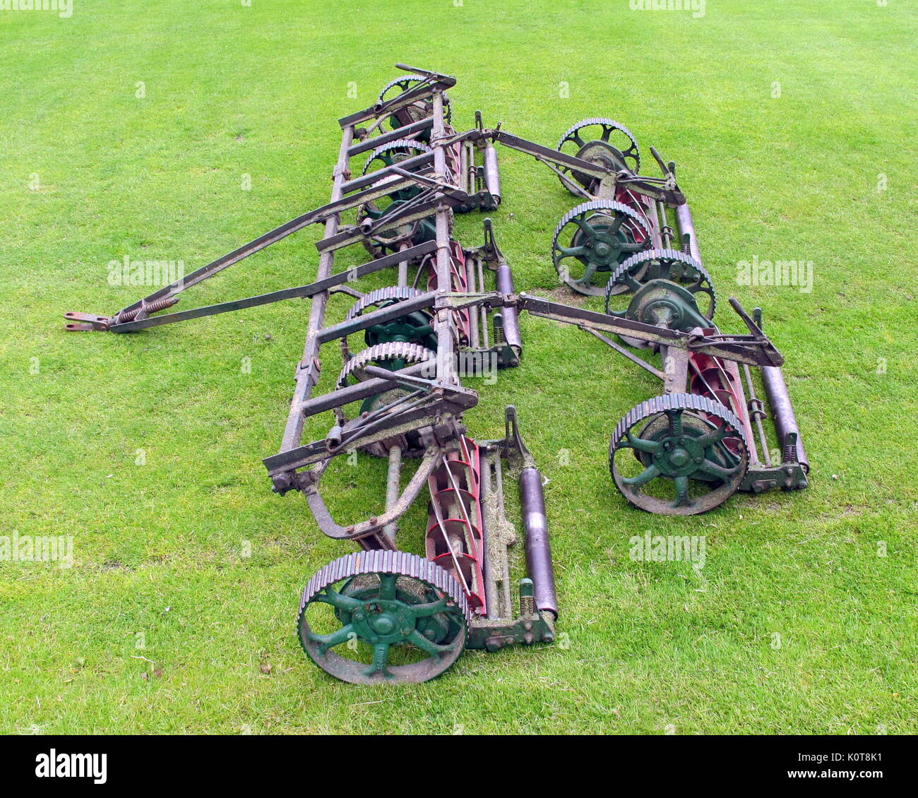 vintage lawn mower tractor  cutting blades green grass pitch  Hamilton Crescent cricket ground Glasgow, Scotland historic football  location Stock Photo
