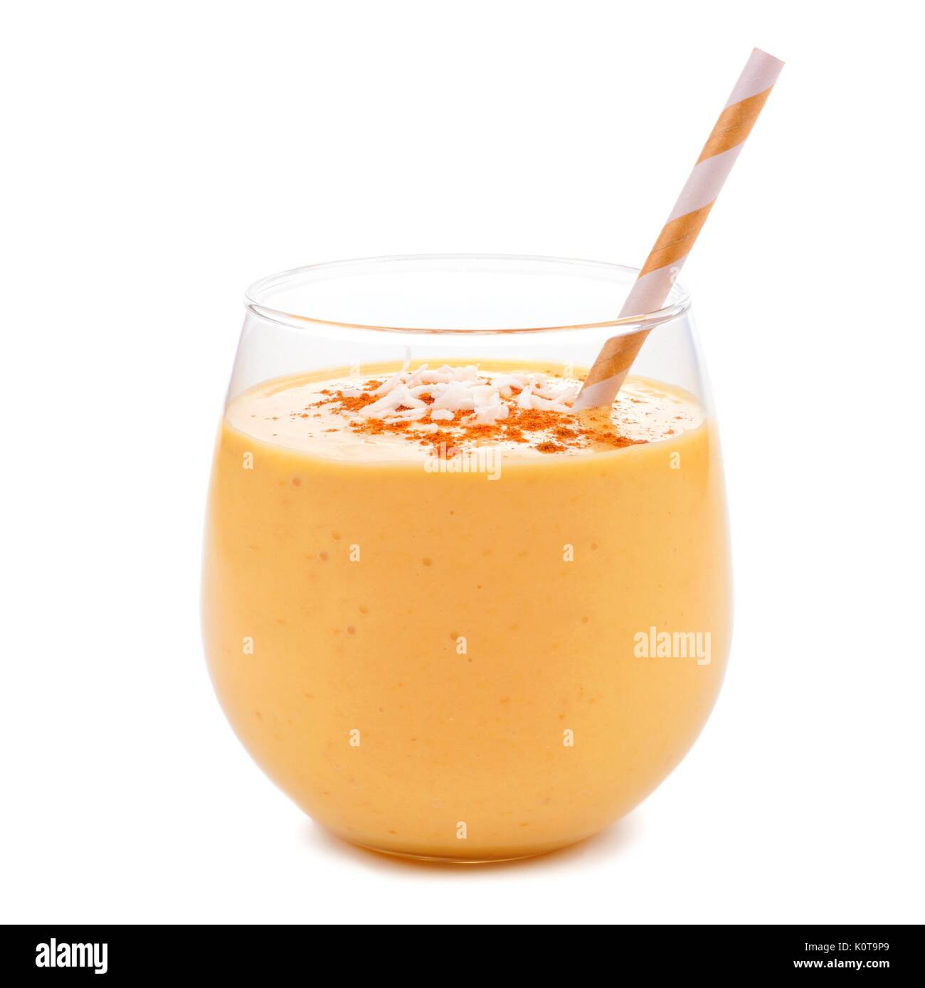 Pumpkin smoothie with coconut in tumbler glass with straw isolated on white Stock Photo