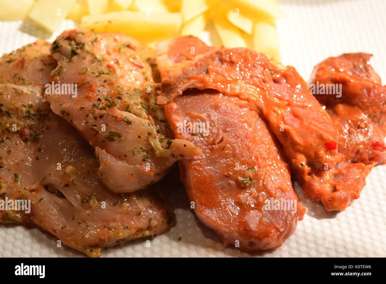 Chicken and pork fillet with chips Stock Photo Alamy
