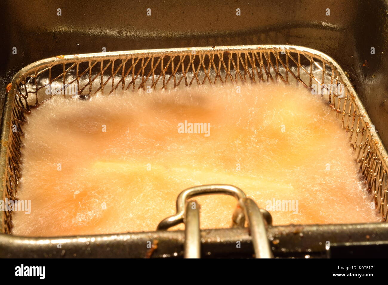 French fries cooking in a deep fryer Stock Photo Alamy