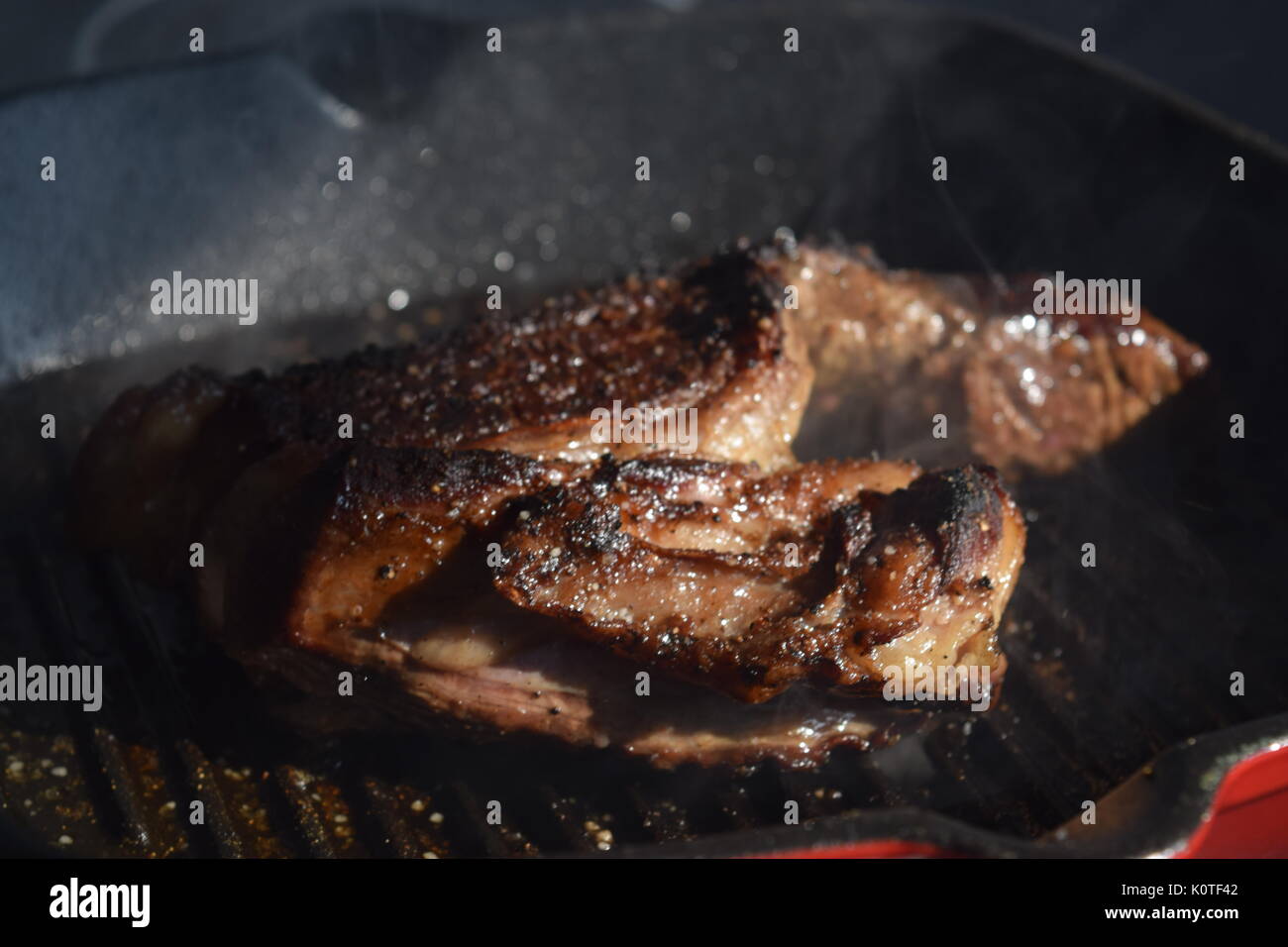 Meat cooking on a grill Stock Photo - Alamy