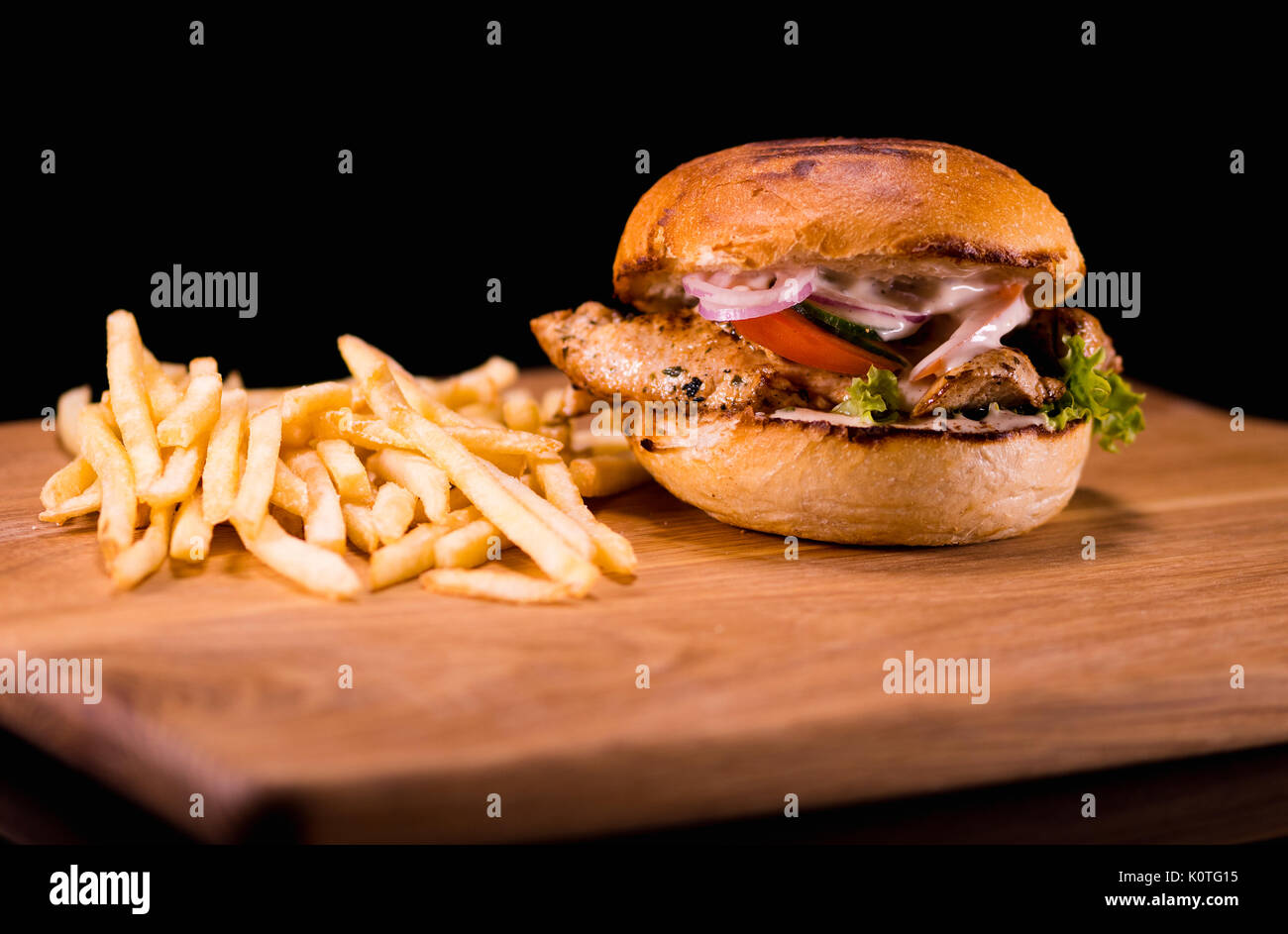 Typical American Fast Food Chickenburger with fries Stock Photo Alamy