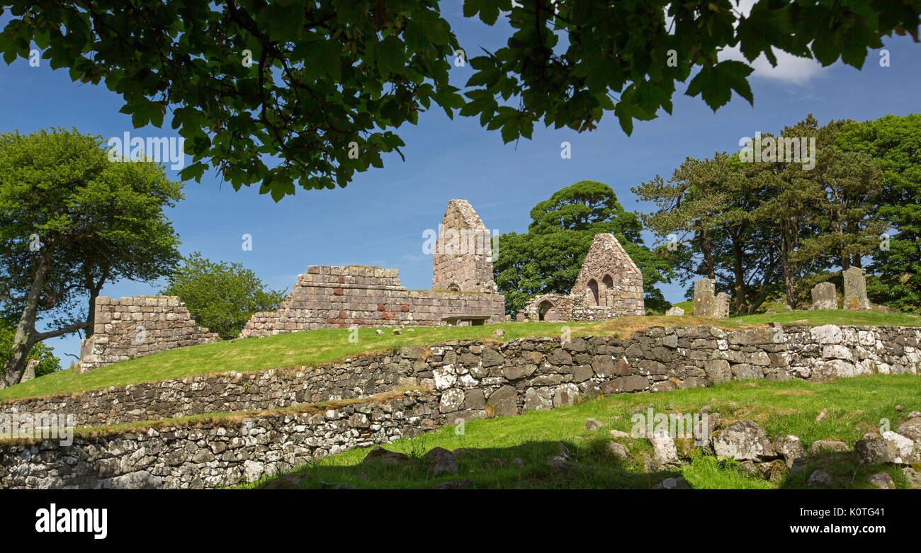 Panoramic view of ruins of historic 13th century Saint Blane's church and monastery against blue sky on island of Bute, Scotland Stock Photo