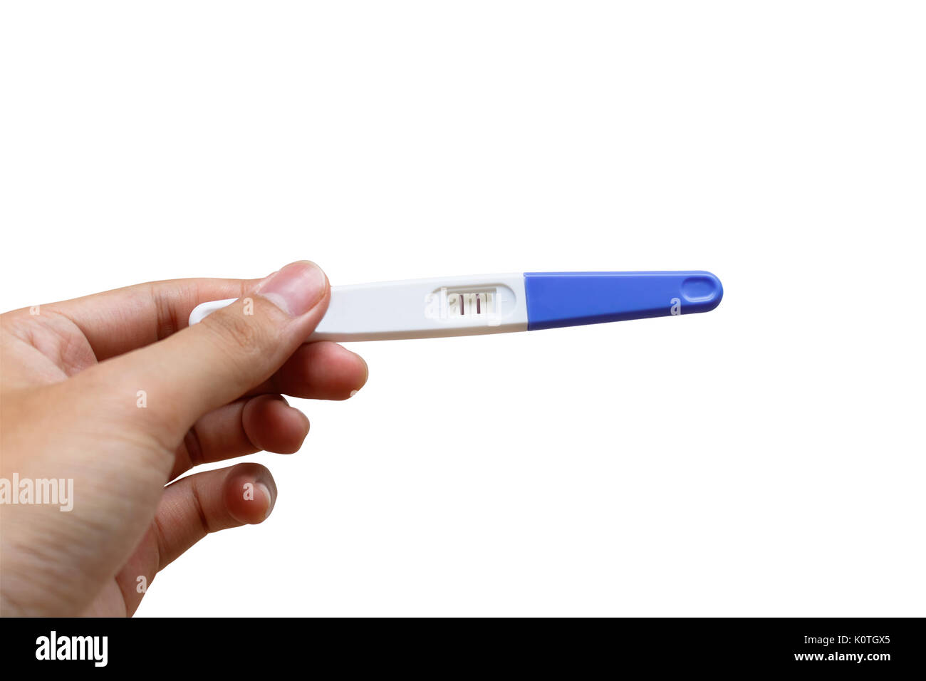Woman is holding positive pregnancy test in her hand. Close-up. Isolated on white background.With clipping path. Stock Photo
