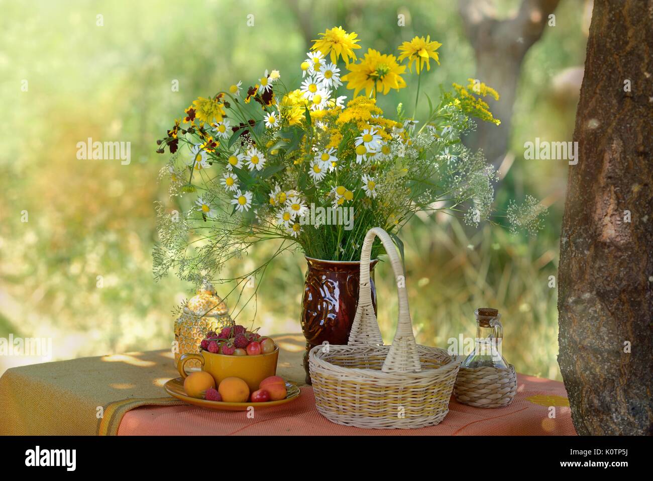 Still life with flowers and berries Stock Photo - Alamy