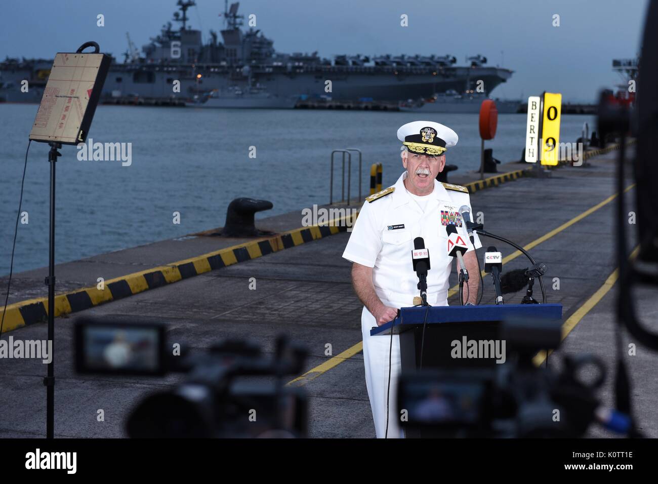 U.S. Adm. Scott Swift, commander of U.S. Pacific Fleet, speaks to news media at Changi Naval Base following the collision of the USS John S. McCain with a civilian tanker ship August 22, 2017 in Singapore. The guided-missile destroyer sustained significant damage while underway east of the Strait of Malacca resulting in ten sailors missing and believed dead. Stock Photo