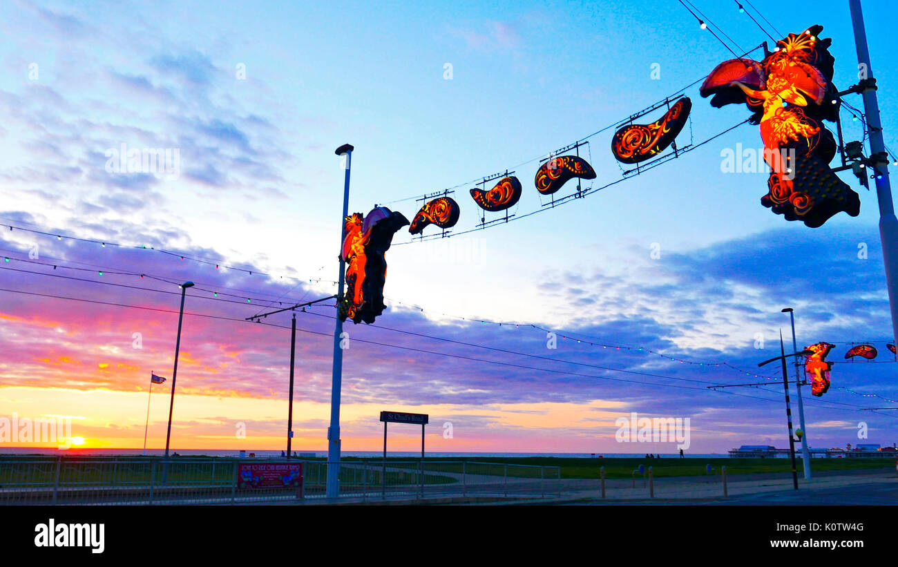 Blackpool, UK. 23rd August 2017. UK Weather. Blackpool illuminations 2017. Testing the lights against a glorious sunset over the sea before the official switch on on Friday 1st September. Credit: kevin walsh/Ģ����ý Live News Stock Photo