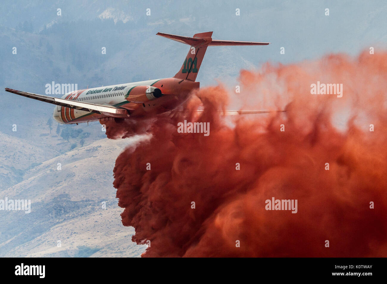 Reno, Nevada, USA. 23rd Aug, 2017. A firefighting airplane drops fire retardant on the Mogul Fire in northwest Reno, Nevada, on Wednesday, August 23, 2017. The cause of the fire has not been determined at this time. Credit: Tracy Barbutes/ZUMA Wire/Alamy Live News Stock Photo