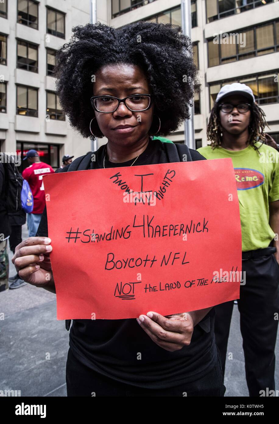 New York City, New York, USA. 23rd Aug, 2017. New Yorkers rallied behind now-unsigned NFL player Colin Kaepernick who has remained seated during the singing of the US Nation. al Anthem since 2016. Kaepernick has stated ''I am not going to stand up to show pride in a flag for a country that oppresses black people and people of color.' Credit: ZUMA Press, Inc./Alamy Live News Stock Photo