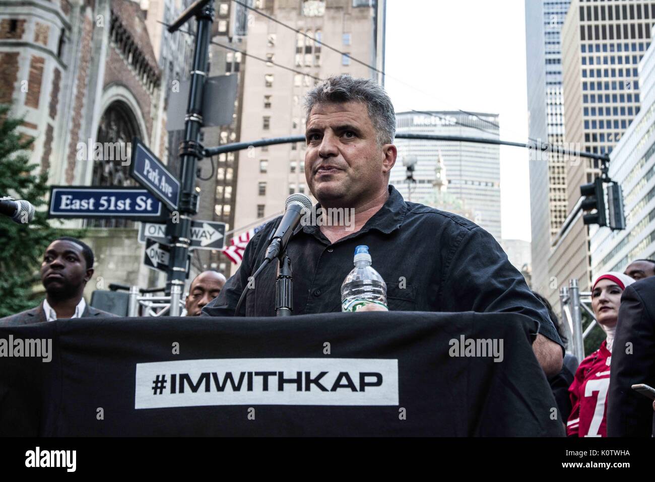 New York City, New York, USA. 23rd Aug, 2017. Dave Zaran of The Nation. New Yorkers rallied behind now-unsigned NFL player Colin Kaepernick who has remained seated during the singing of the US Nation. al Anthem since 2016. Kaepernick has stated ''I am not going to stand up to show pride in a flag for a country that oppresses black people and people of color.' Credit: ZUMA Press, Inc./Alamy Live News Stock Photo