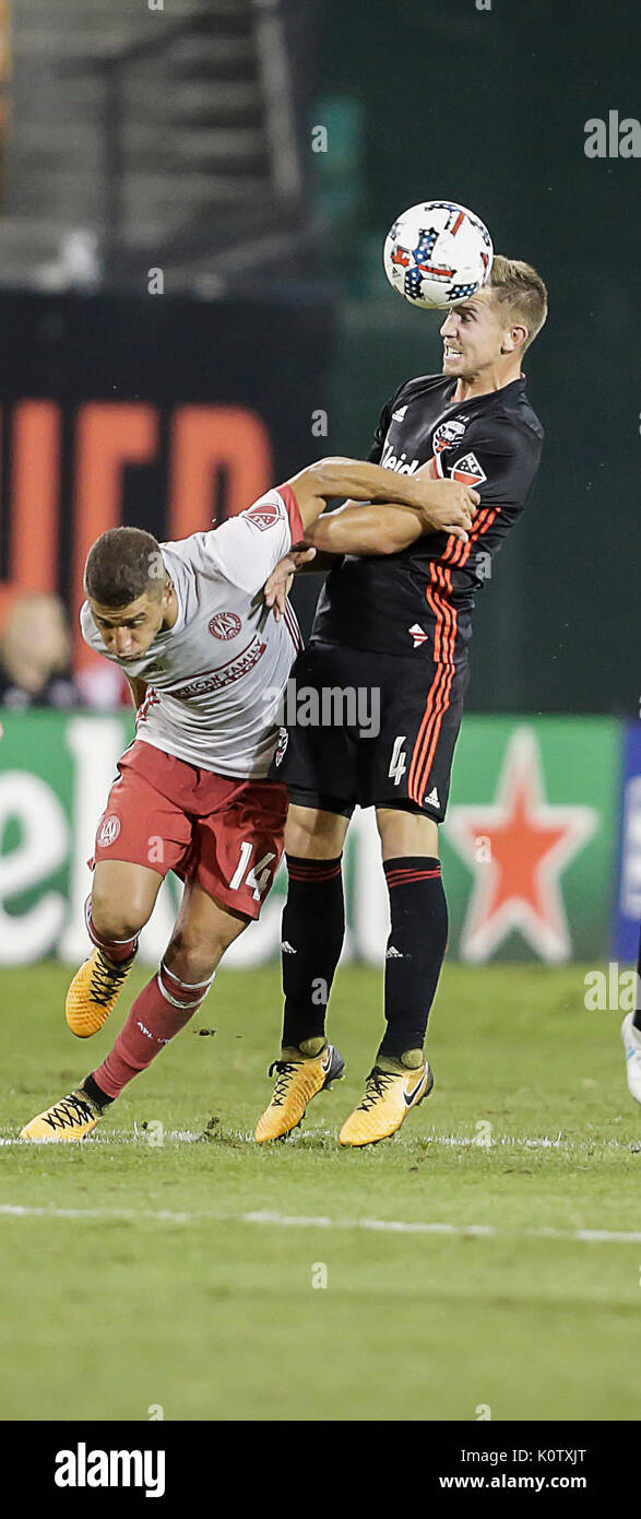 Washington, DC, USA. 23rd Aug, 2017. D.C. United Midfielder #4 Russell Canouse brings the ball down with his head behind Atlanta United FC Midfielder #14 Carlos Carmona during an MLS soccer match between the D.C. United and the Atlanta United FC at RFK Stadium in Washington DC. Credit: Cal Sport Media/Alamy Live News Stock Photo