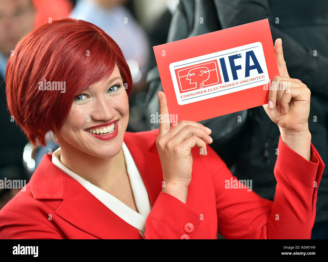 Berlin, Germany. 24th Aug, 2017. 'Miss IFA' holding in her hands a sign with the IFA logo during the press conference of the Electronics Fair IFA in Berlin, Germany, 24 August 2017. The fair runs between 01 and 06 September 2017. Photo: Britta Pedersen/dpa-Zentralbild/dpa/Alamy Live News Stock Photo