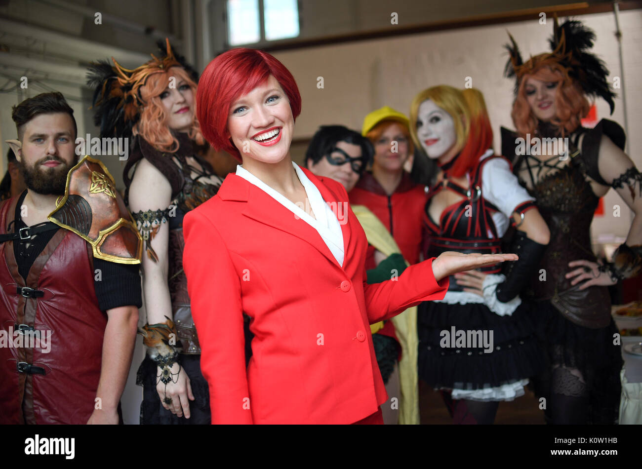Berlin, Germany. 24th Aug, 2017. 'Miss IFA' (C) and cosplayers taking part in the press conference of the Electronics Fair IFA in Berlin, Germany, 24 August 2017. The fair runs between 01 and 06 September 2017. Photo: Britta Pedersen/dpa-Zentralbild/dpa/Alamy Live News Stock Photo