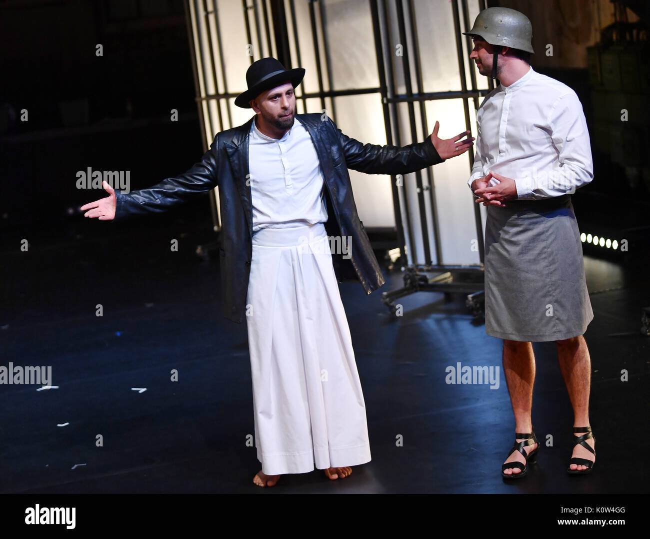 The actors Sulaiman Sohrab Salem (L) and Romaric Seguin performing during a rehearsal of the art festival project 'Malalai - the Afghan virgin of Orleans' in the E-Werk of the German National Theater in Weimar, Germany, 24 August 2017. The play 'The Virgin of Orleans' by Friedrich Schiller was developed with French, Afghan, German and Israeli performers of muslim, jewish, christian and atheistic backgrounds. The Afghan theatre troupe Azar is taking part in this project sponsored by the Federal Foundation for the Arts and the Goethe Institute. The premiere is to take place on 25 August 2017. Ph Stock Photo