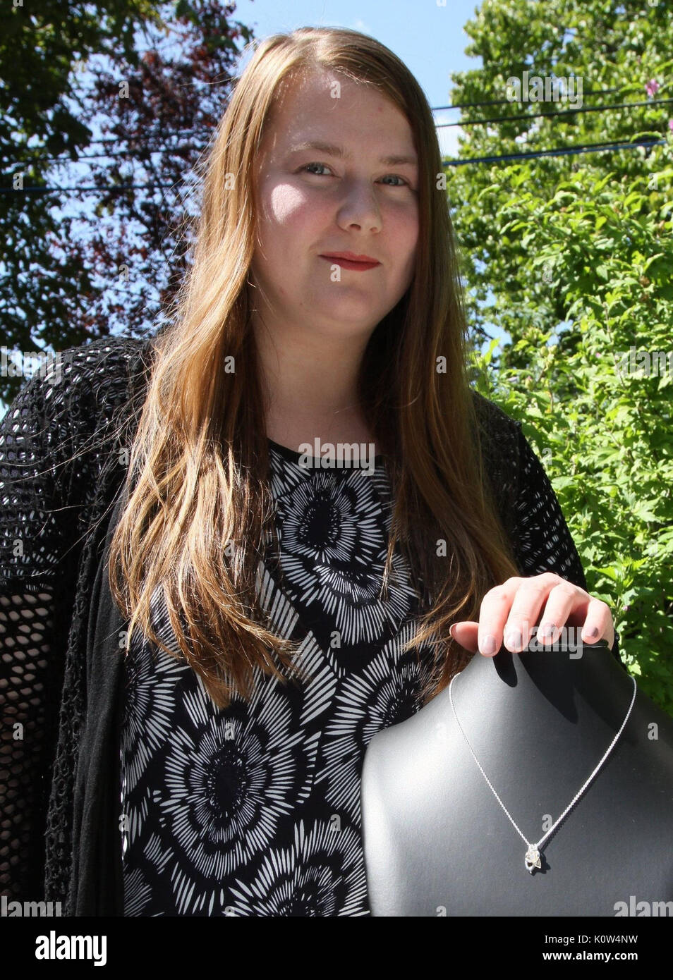 Abduction victim Natascha Kampusch presents a necklace of her five-piece jewellery collection in Vienna, Austria, 21 August 2017. The flower - as a symbol of her own life - can be found as a motive in every piece. Her case moved the entire world. The Viennese was kidnapped as a ten-year-old on her way to school and was held and abused in a cellar for eight years. Eleven years after her liberation, she turns her creative passion into a profession. Photo: Sandra Walder/dpa Stock Photo