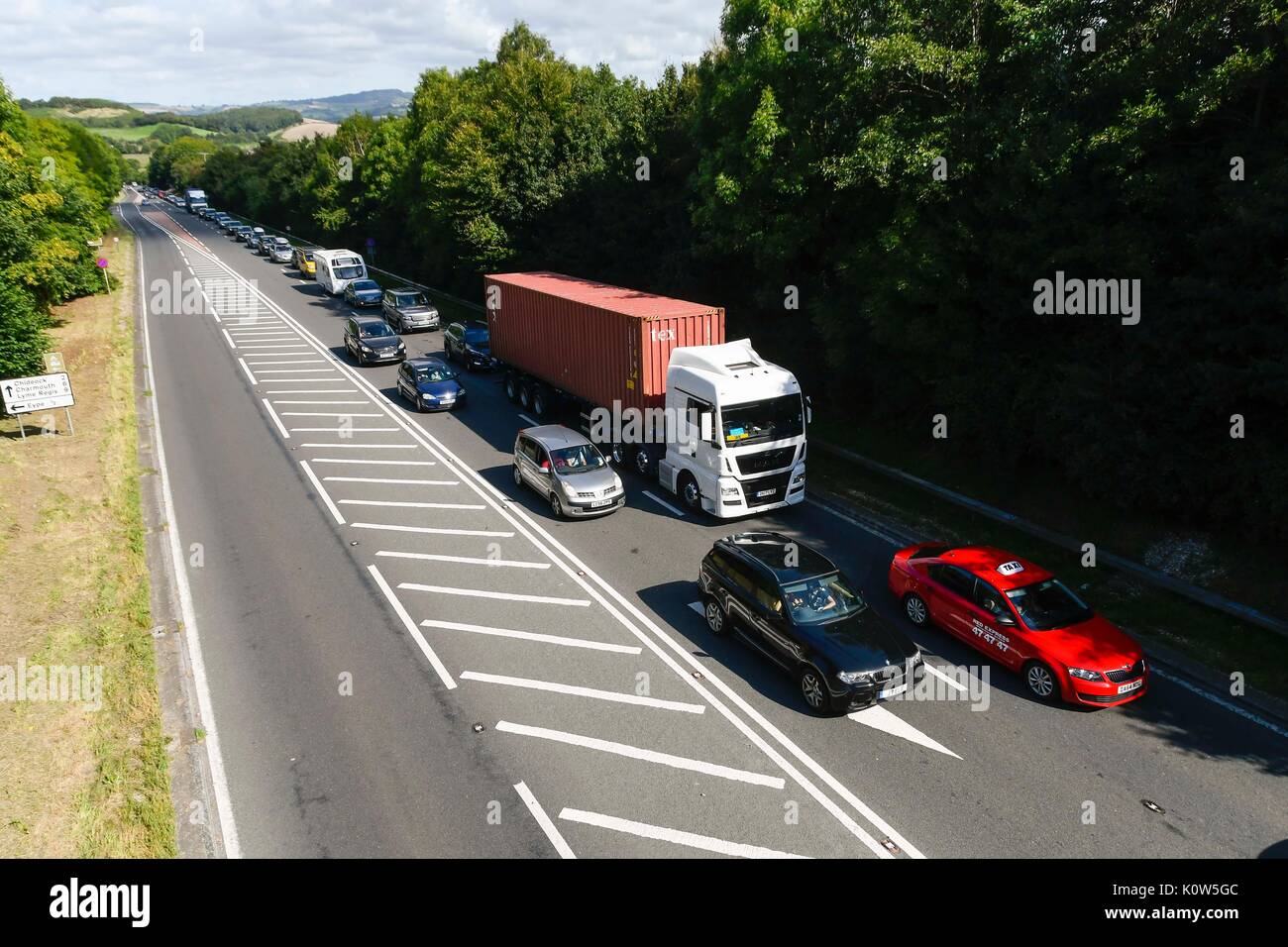 Bridpirt, Dorset, UK. 25th Aug, 2017. UK Weather. Queuing traffic on the A35 Bridport bypass in Dorset on the friday before the August bank holiday as holidaymakers hit the roads as the weather is forecast to be warm and sunny. Photo Credit: Graham Hunt/Alamy Live News Stock Photo