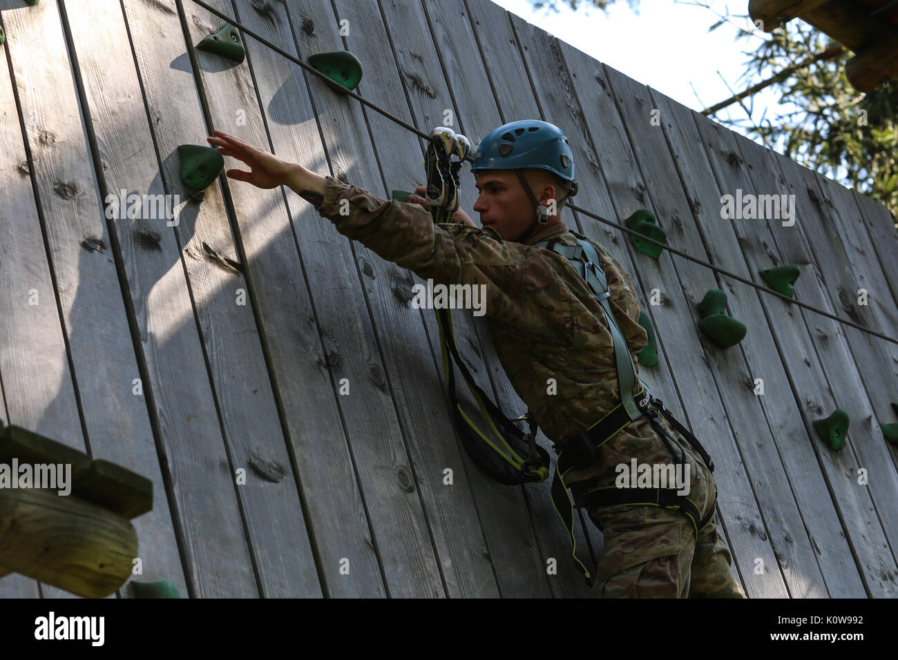A U.S. Army specialist navigates a high ropes obstacle during the ...