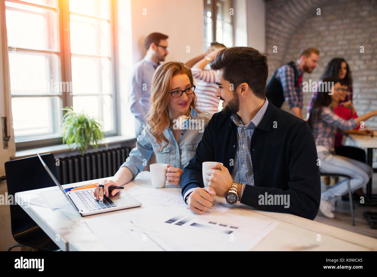 Two young perspective architects working on laptop Stock Photo
