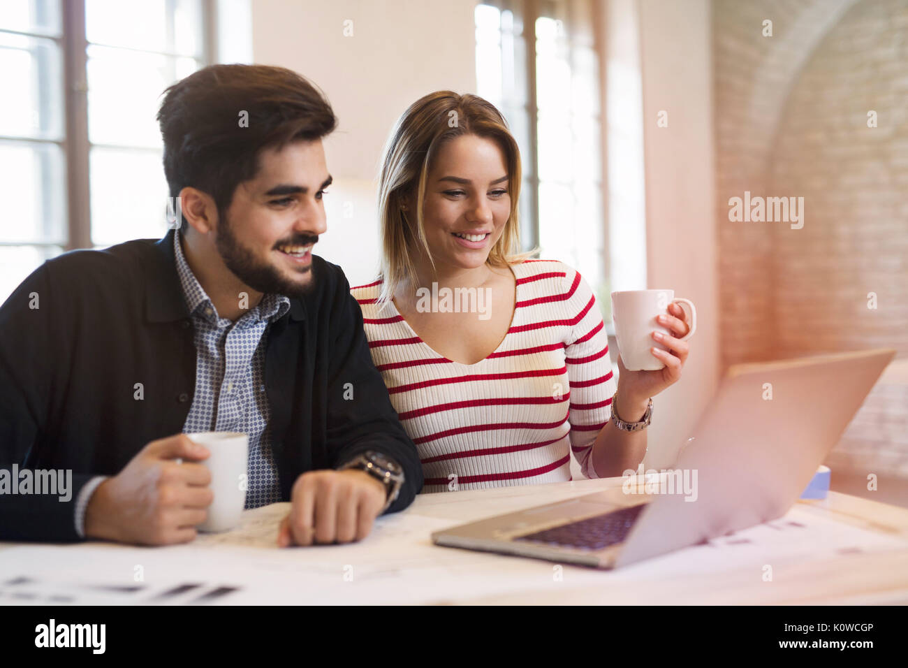 Two young perspective architects working on laptop Stock Photo