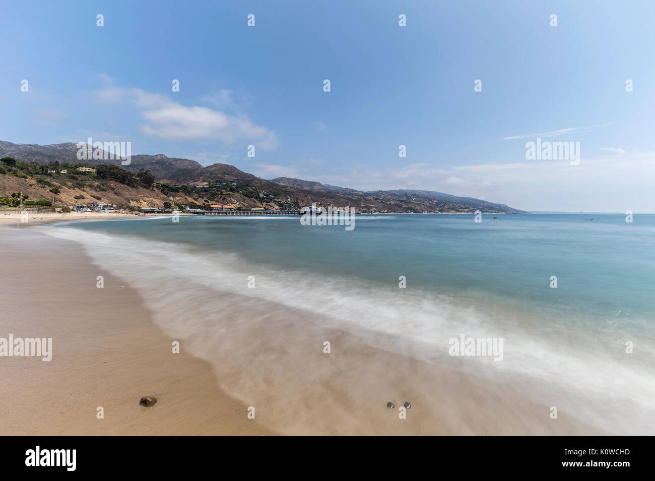 Malibu beach with motion blur surf near Los Angeles in Southern California. Stock Photo