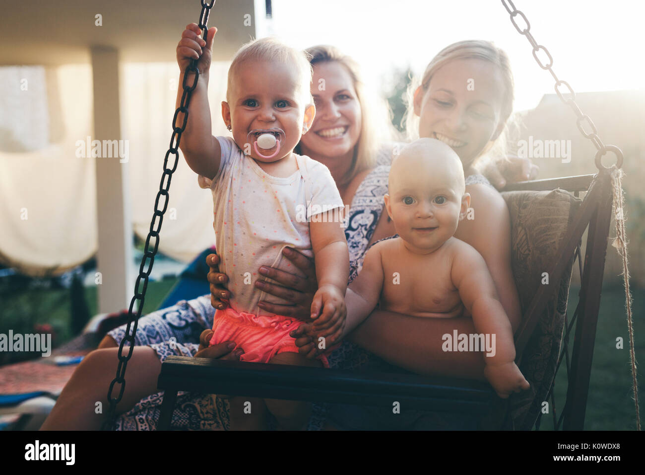 Happy mothers having great time with their children Stock Photo