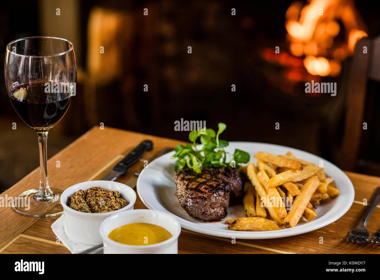 Steak and chips by the fireside Stock Photo Alamy