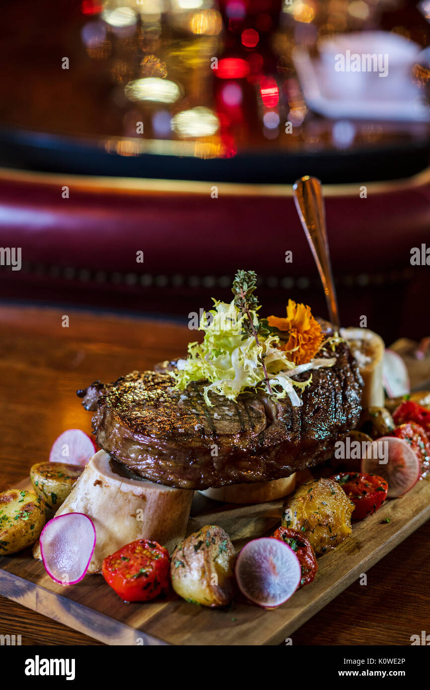 High-end steak on bone marrow dish Stock Photo
