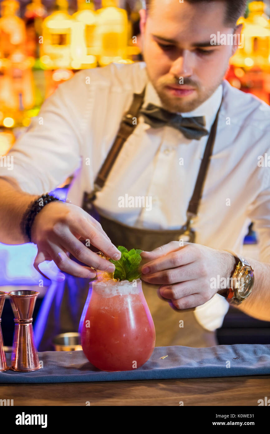 Mixologist creating cocktail Stock Photo