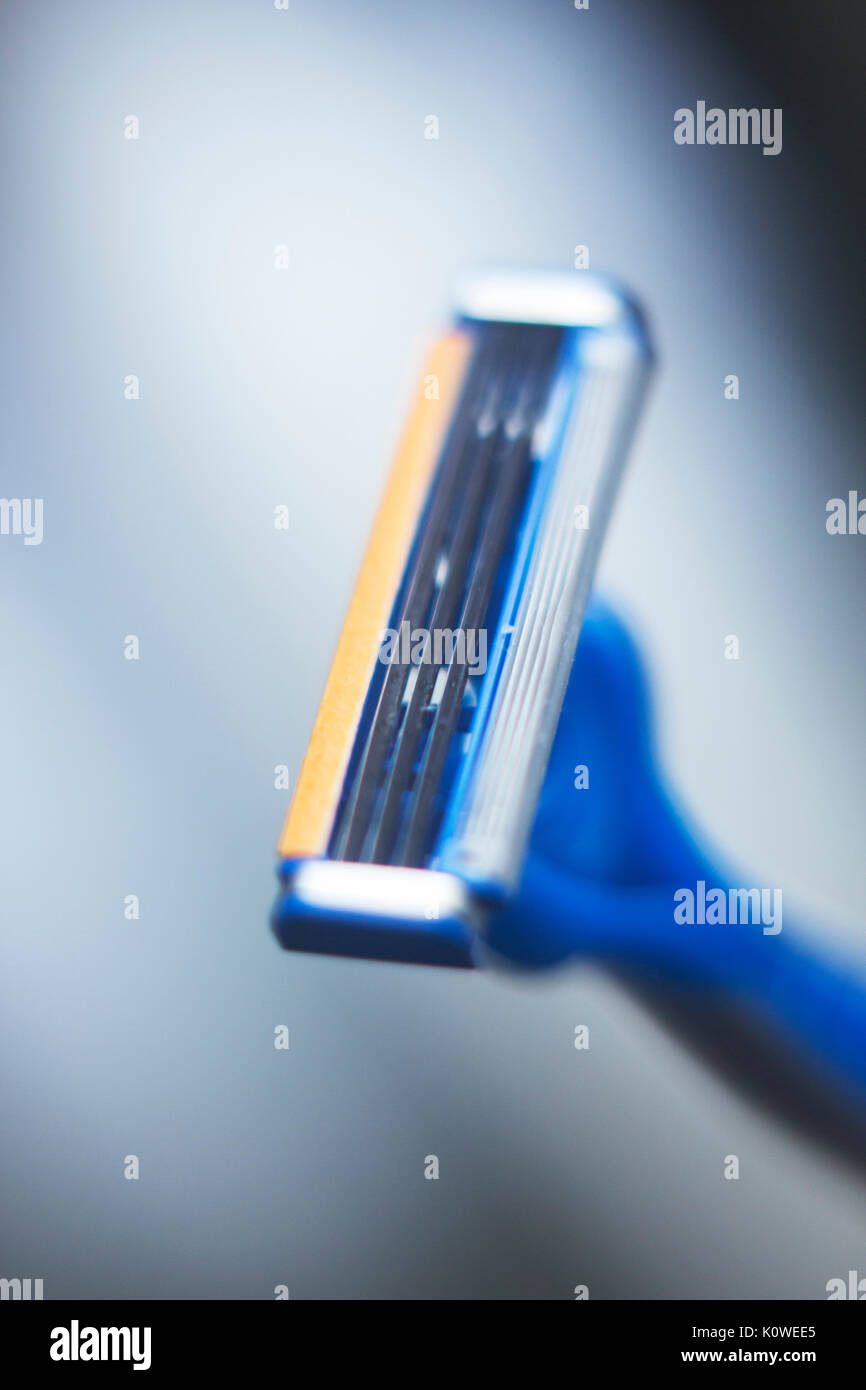 Modern safety disposable plastic shaving razor with multiple blades and ...