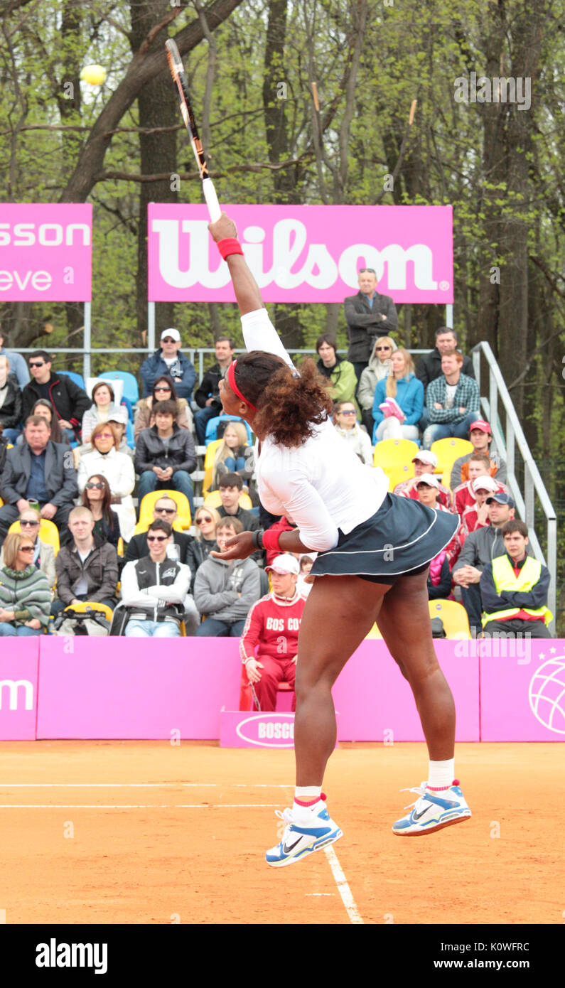 KHARKOV, UKRAINE - APRIL 22, 2012: Serena Williams serve a ball during Fed Cup tie between USA and Ukraine in Superior Golf and Spa Resort, Kharkov, U Stock Photo