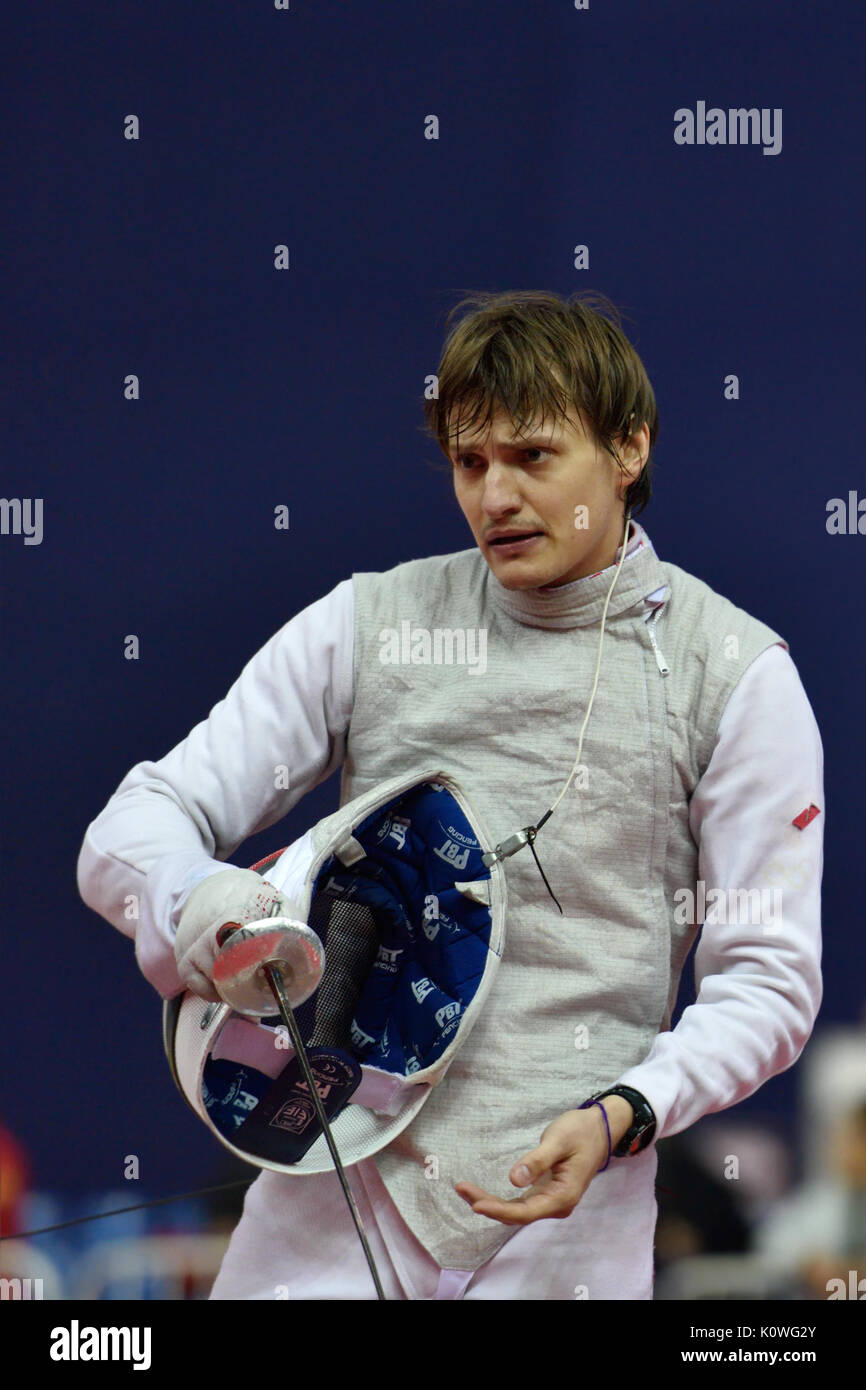 St. Petersburg, Russia - May 3, 2015: Alexey Cheremisinov of Russia in team quarterfinal of 41th International fencing tournament St. Petersburg Foil. Stock Photo