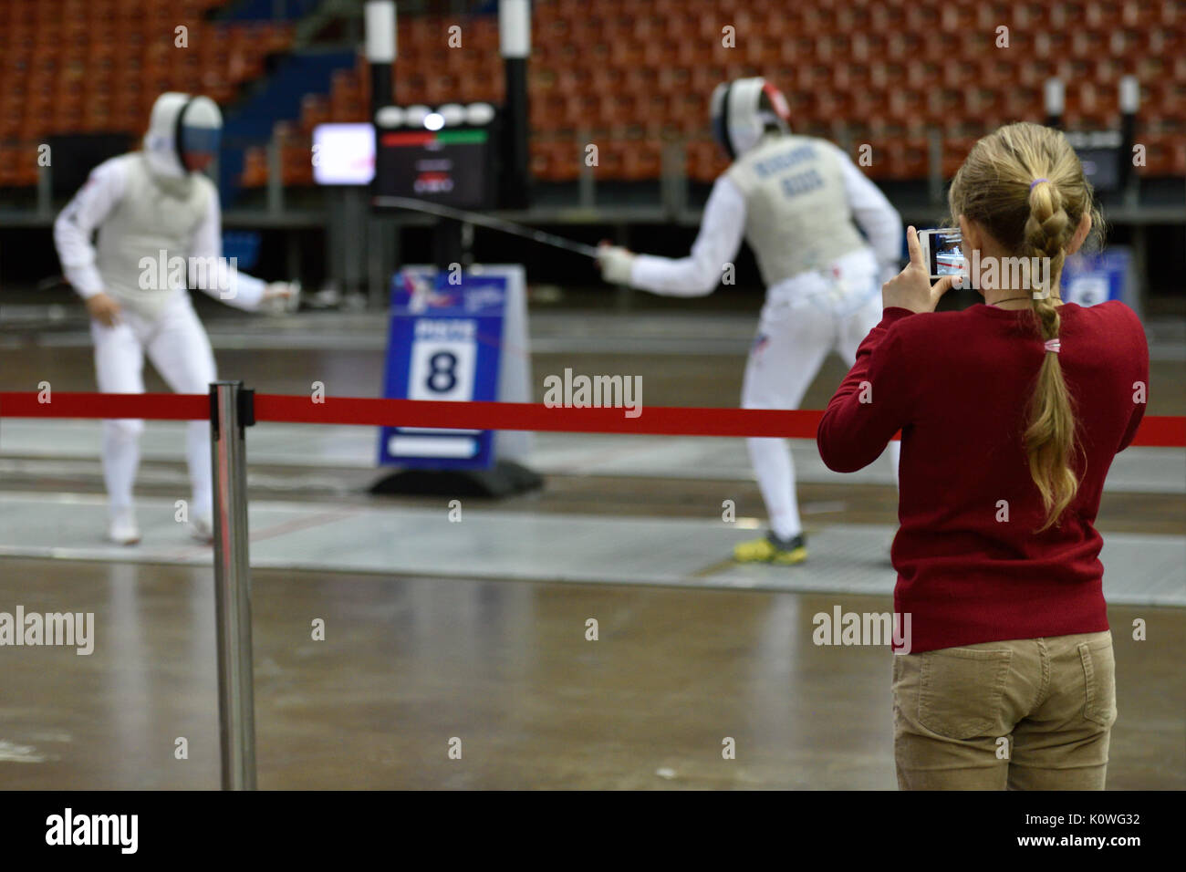 St. Petersburg, Russia - May 3, 2015: Girl make photo of Russian fencers training during the International fencing tournament St. Petersburg Foil, The Stock Photo
