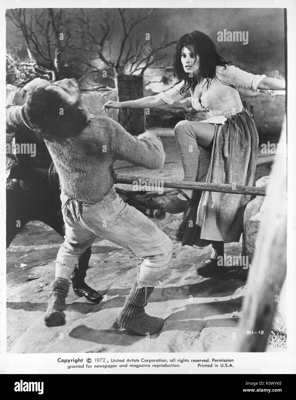 Sophia Loren, kicking a man in the face, movie still from the film Man of La Mancha, 1972. Stock Photo