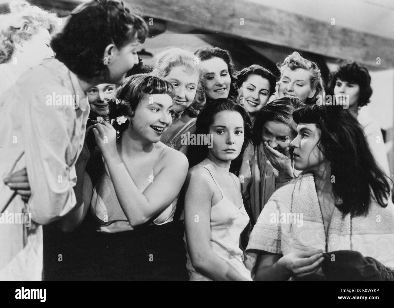 Au Royaume Des Cieux (In the Kingdom of Heaven), movie still of girls in a dormatory, several girls appearing to taunt another girl, from the film noir movie by director Julien Duvivier, which tells the story of girls in a female reformatory who are persecuted by a sadistic head warden, and who attempt to escape with the help of the heroines lover, played by Serge Reggiani, 1949. Stock Photo