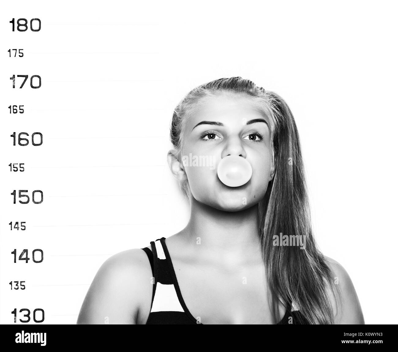 Young beautiful blonde woman chewing gum and blowing bubbles Criminal ...