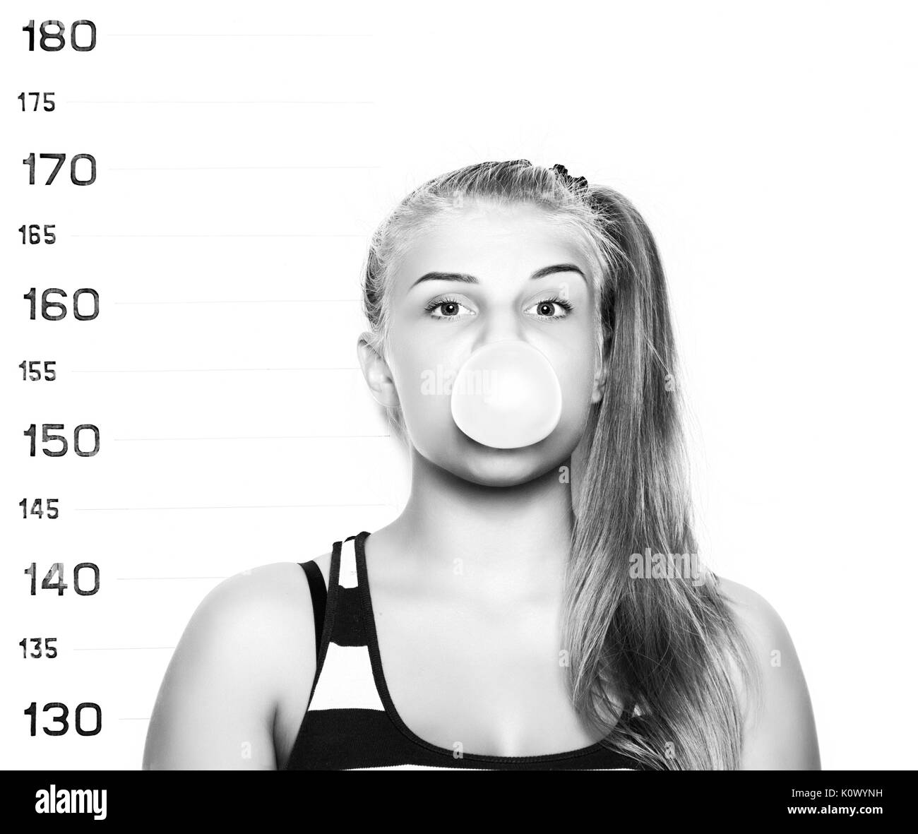 Young beautiful blonde woman chewing gum and blowing bubbles Criminal ...