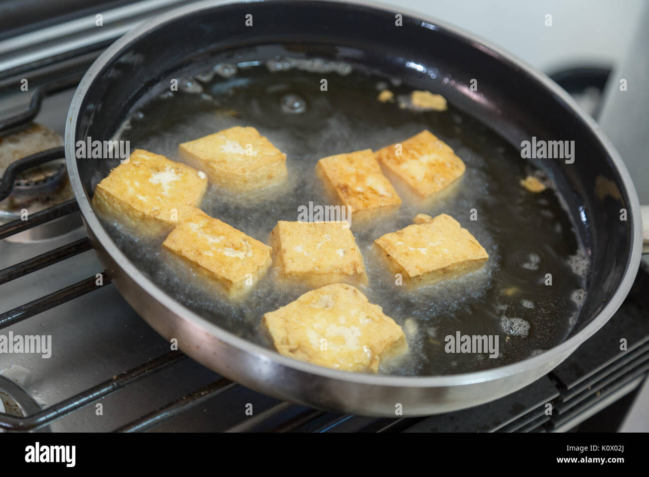 Pan fried crispy tofu Stock Photo - Alamy