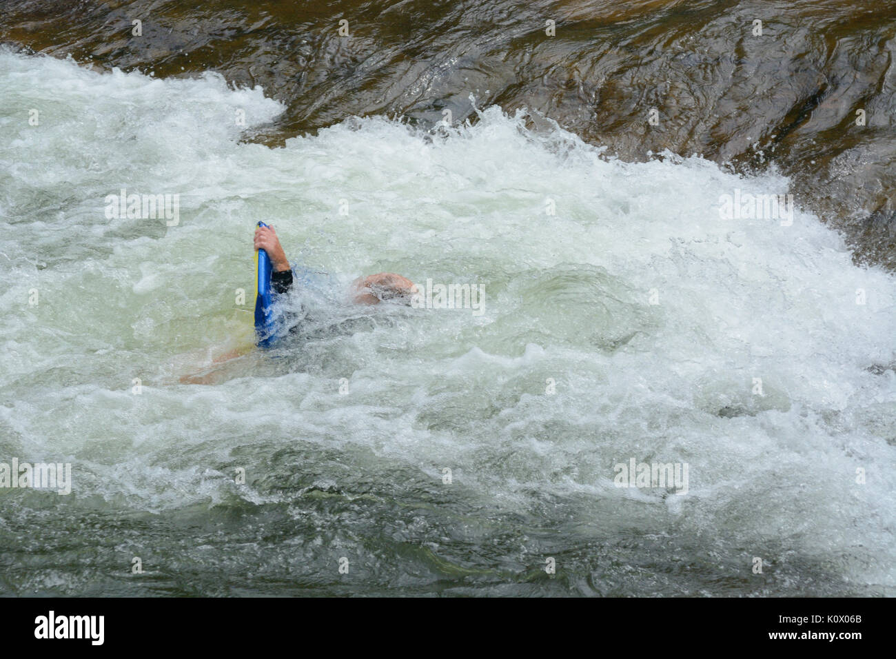 Rafting wipe out on white water rapid at Clear Creek White Water Park in Golden, Colorado Stock Photo