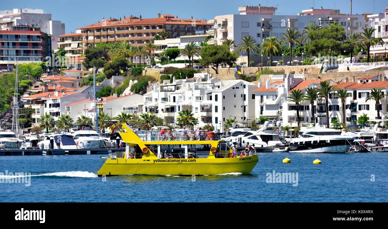 Yellow catamaran glass bottom boat trip Mahon Menorca Minorca Spain Stock Photo