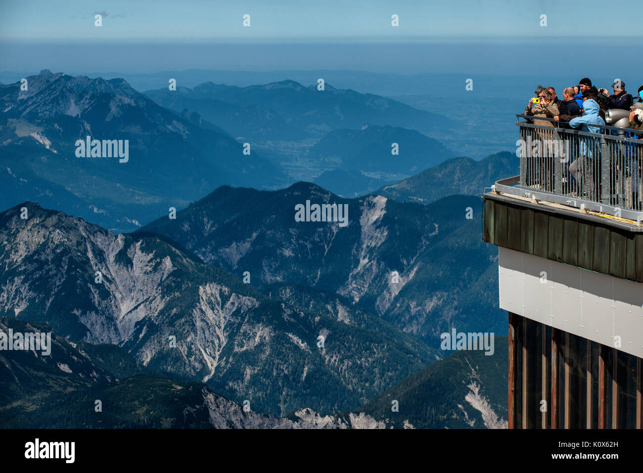 Visitors on the summit of the Zugspitze on the Germany Austria border. Stock Photo