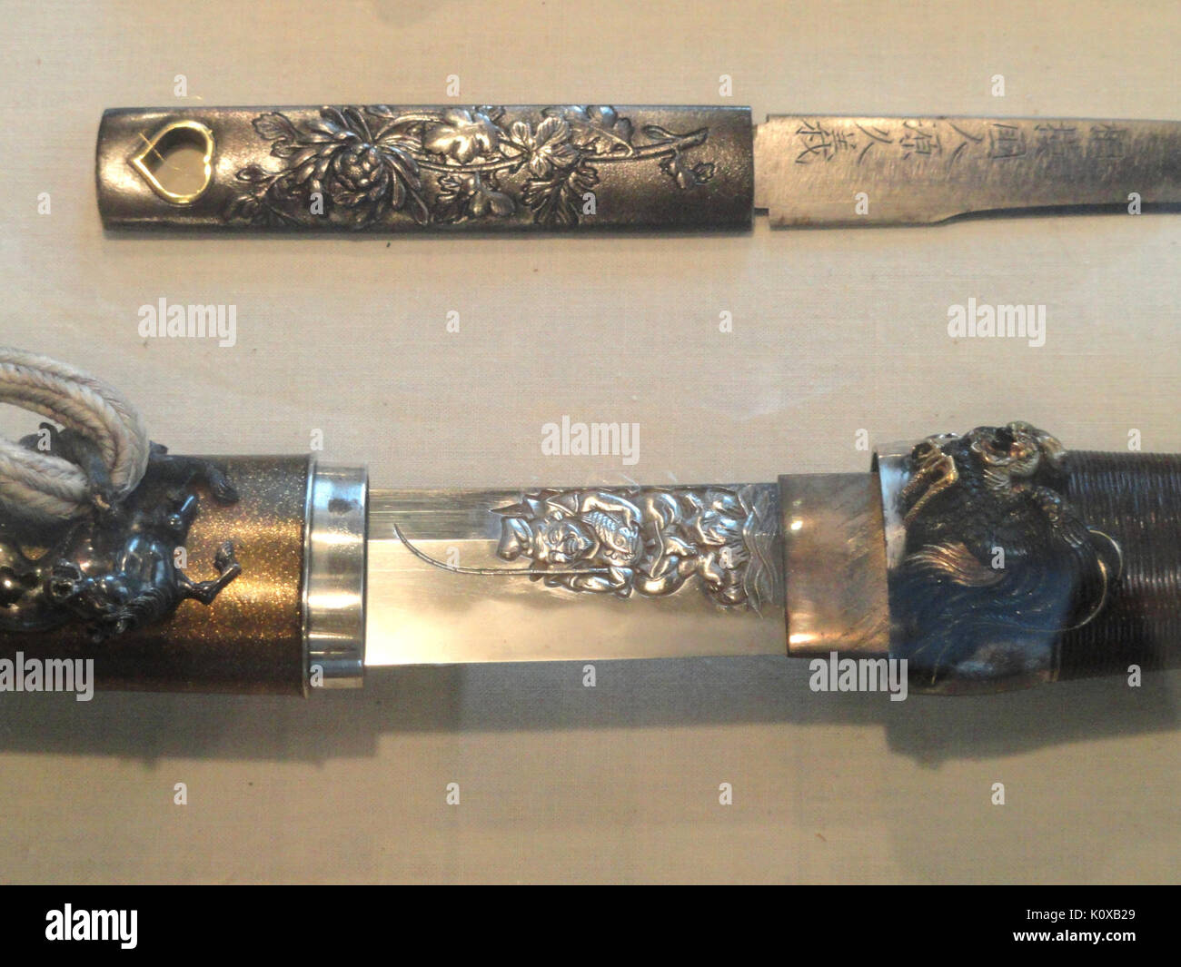 Aikuchi dagger with Fudo carving, blade by Umetada Akinaga of Yamashiro, 1704   George Walter Vincent Smith Art Museum   DSC03630 Stock Photo