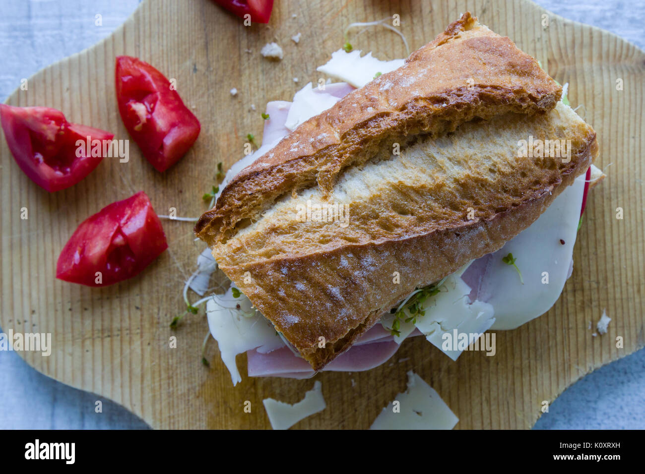 rustic big ham sandwich on wooden board Stock Photo