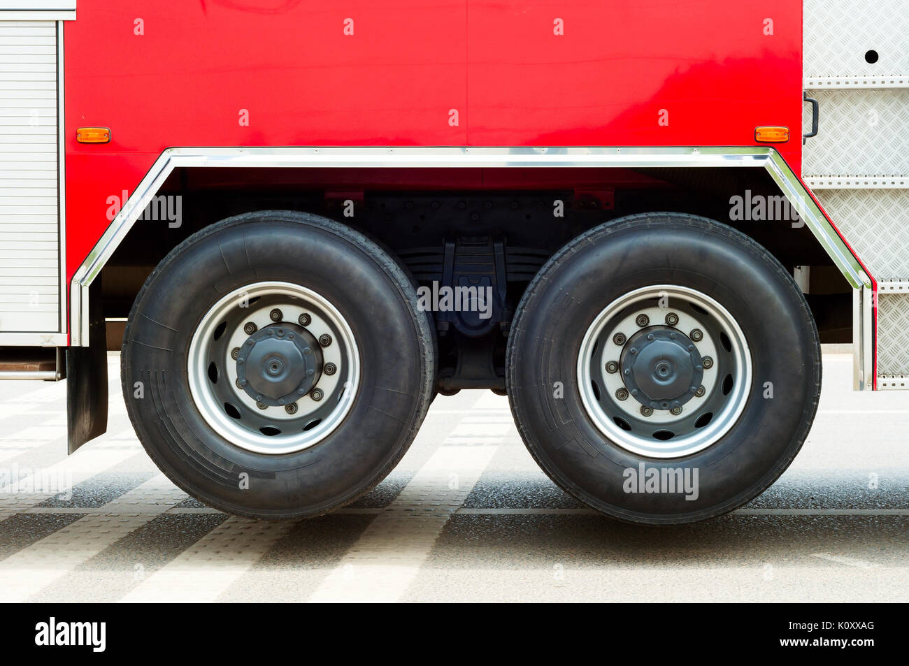 Fire truck partial feature, large area of red and wheels. Stock Photo